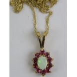 A delightful 9ct gold opal and ruby pendant,