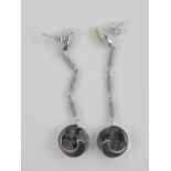 A pair of 18ct white gold earrings having labradorite discs with white gold wave setting suspended