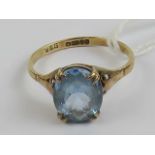 A 9ct gold and aquamarine ring, the large central oval cut aquamarine measuring 9.8 x 8 x 4.