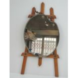 A vintage wall mirror in the form of an artist's easel and paint pallet, mirror measuring 29.