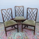 A set of three 19th century mahogany lattice back dining chairs, each with drop in seat.