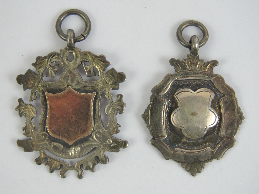 Two silver fobs, both unengraved, one with makers mark no apparent hallmark,