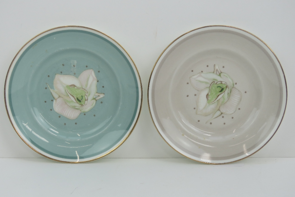 Two Susie Cooper side plates in teal and