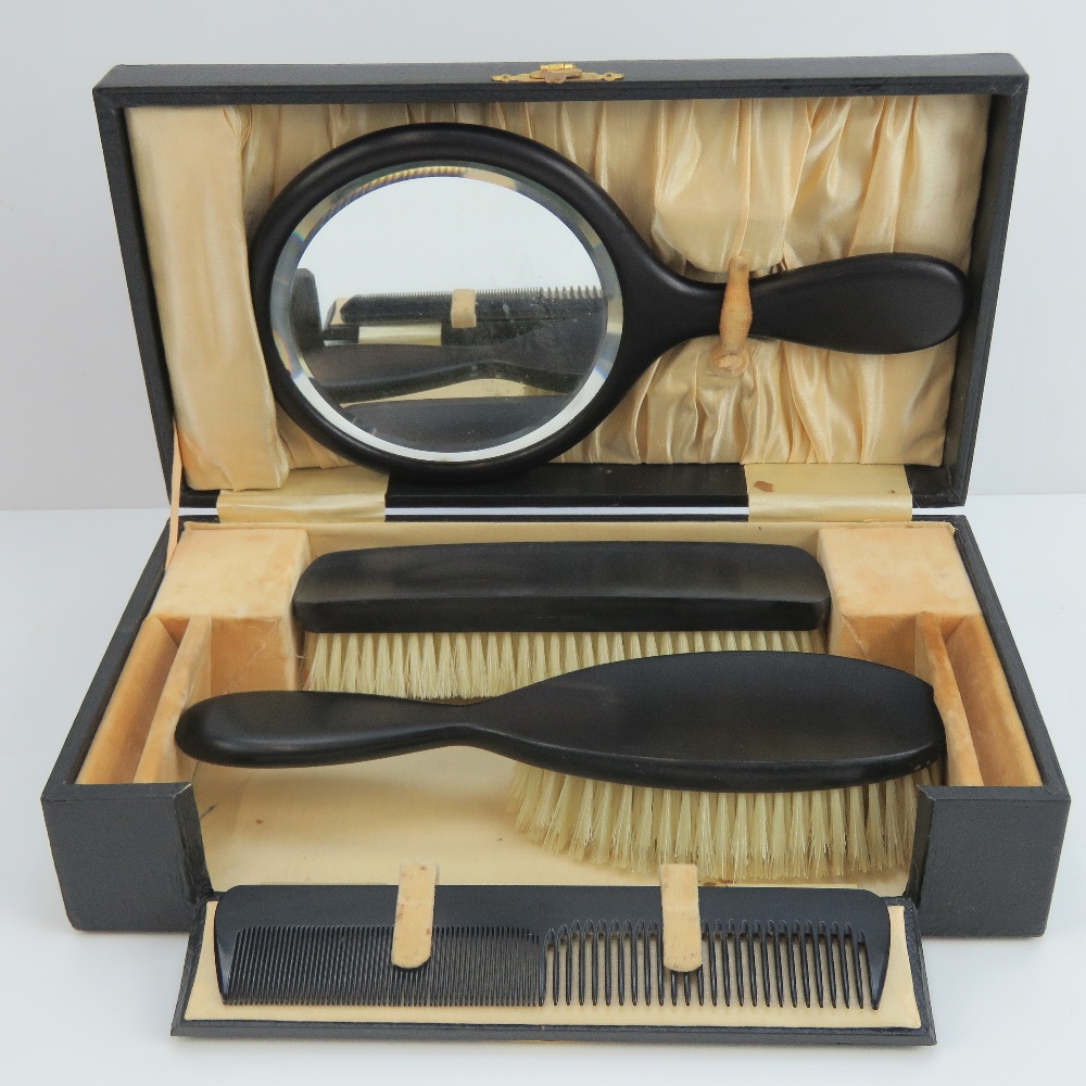 A vintage travelling dressing table set