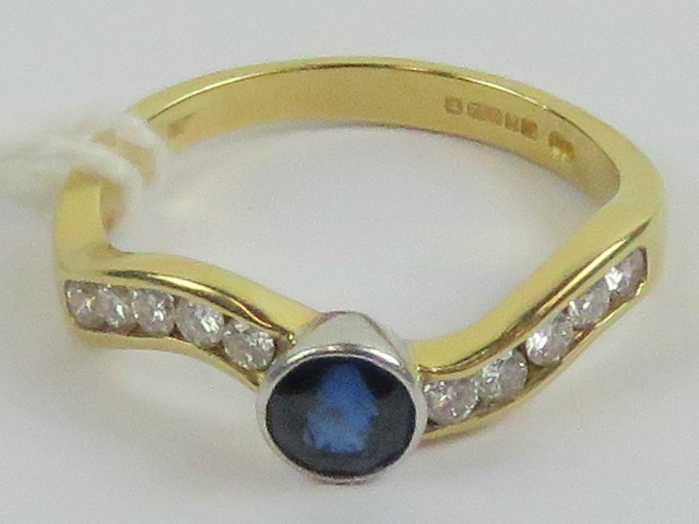 An 18ct gold sapphire and diamond ring,