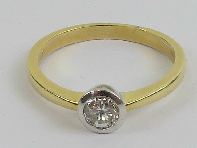 An 18ct gold and diamond solitaire ring,