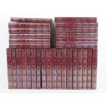 Books; a set of Burgundy leatherette bou