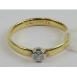 An 18ct gold solitaire diamond ring, the