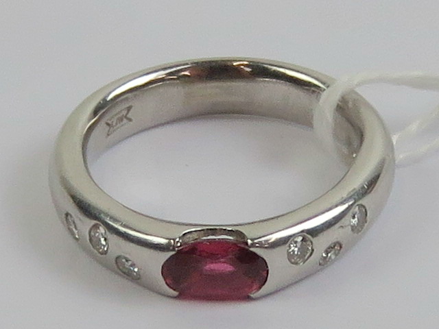 An 18ct white gold ruby and diamond ring