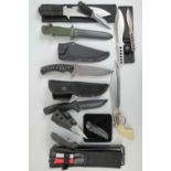 A quantity of assorted daggers, some with sheaths, including dagger by Boker with plastic sheath,