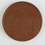 A commemorative double-sided clay Colditz Castle DDR coin/token,