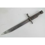 A WWI Canadian Military issue Ross rifle bayonet dated 1916 with regiment marks upon.