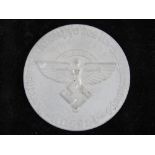 A commemorative WWII German NSFK Pilots Flying Club award plaque/coin.