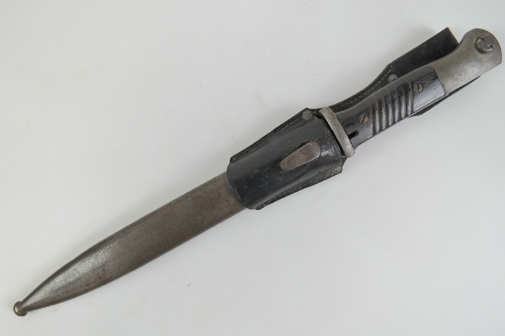 A WWII German Mauser K98 Rifle Bayonet with scabbard and frog, dated 1939.