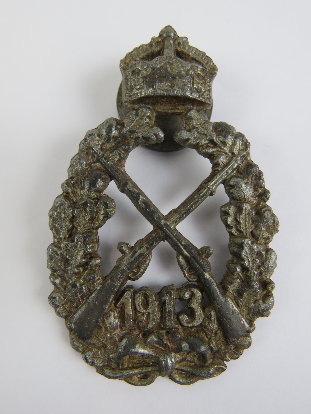 A WWI German Military issue Infantry award badge dated 1913 having screw back.