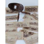 A mahogany stereoscope entitled 'The Perfecscope' with folding handle and fifteen Underwood &