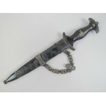 A reproduction WWII German SS dagger with engraved blade, fitted scabbard together with chain,
