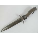 A WWII German DeMag fighting knife bayonet having scabbard and maker marks upon.