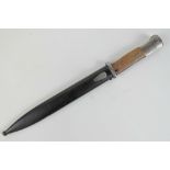 A reproduction WWII German ceremonial presentation SS engraved Mauser K98 bayonet dated 1944 having