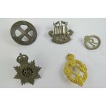 Five assorted officer's badges including Army Educational Corp, Women's Transport Service, etc.
