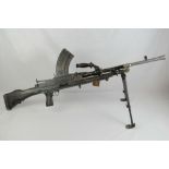 A 1941 Bren machine gun complete with bi-pod, single magazine and carry handle.