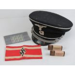 A quantity of reproduction WWII German Military items including; Hitler youth armband,