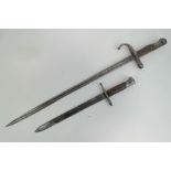 An Itallian Carcano model 1891 rifle bayonet, and a Turkish model 1903 sword bayonet.