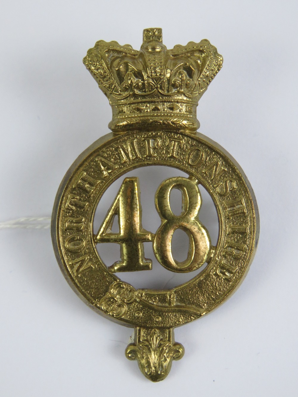 A British 48th Regiment Glengarry badge, Northamptonshire Regiment, measuring 7cm high.