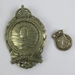 A silvered Mine Clearance Service badge together with a silvered Officer's hat badge. Two items.