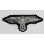 A WWII German Waffen SS Officers silver thread tunic sleeve eagle.