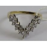 A diamond wishbone shaped ring, eighteen brilliant round cut diamonds, approx total 0.
