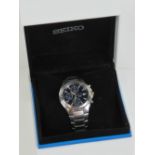 A Seiko Chronograph wristwatch in unworn condition with original inner and outer boxes,