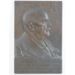 A large heavy cast Bronze wall plaque bearing tribute to Milton V. Ely, CBE and dated 1953.