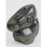 A 20th century smooth stone sculpture marked B Takawira, standing 15cm high.