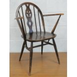 A stained 3/4 size open arm chair bearing Ercol stamp dated 1960 having elm seat,