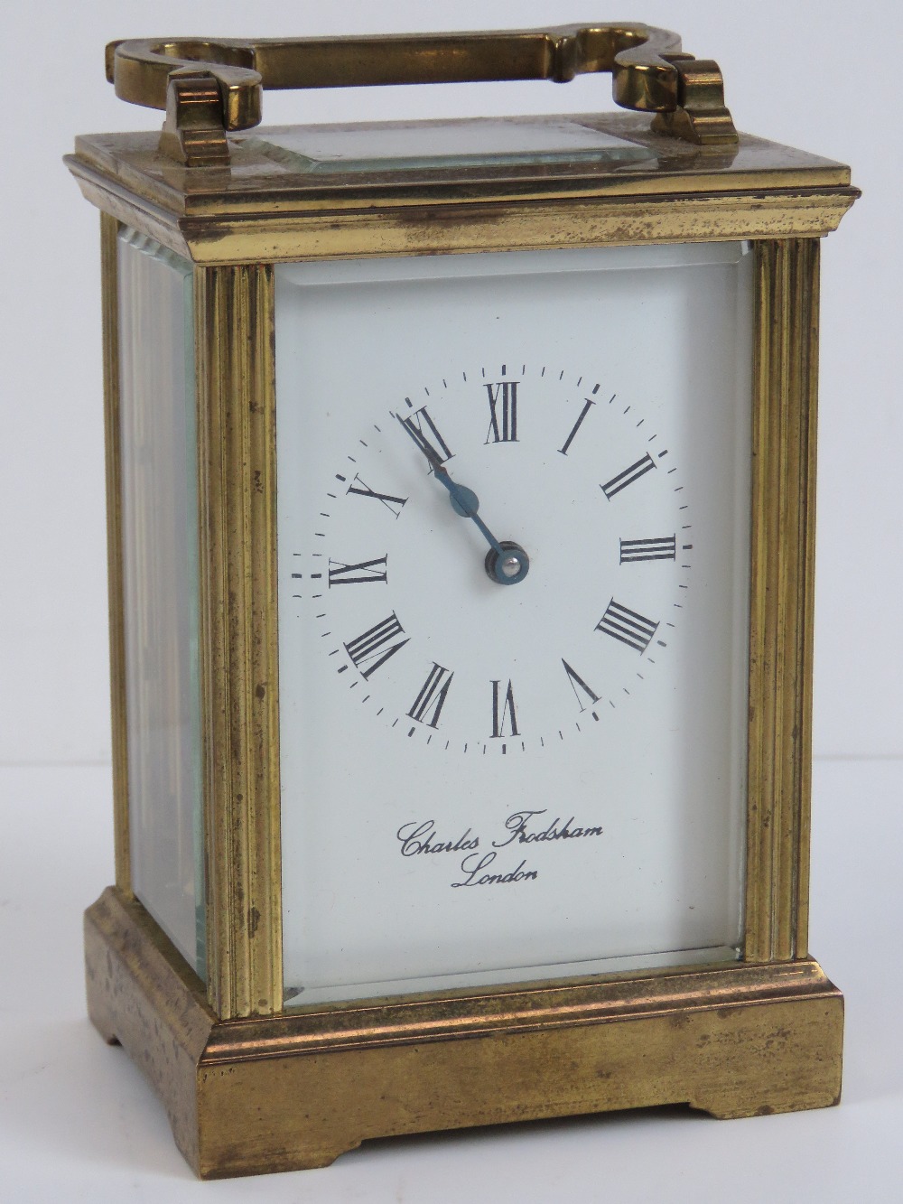 A brass cased five glass carriage clock having enamelled face, Roman numerals,