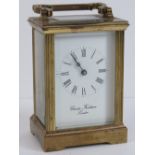 A brass cased five glass carriage clock having enamelled face, Roman numerals,