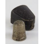 A HM silver thimble in original fitted leatherette box,