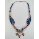 A Native American style handmade necklace having lapis lazuli, coral and turquoise beading,