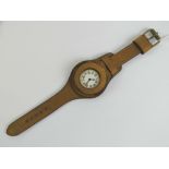 A WWI trench watch having white enamel dial, new brown leather Oscar Moser strap,