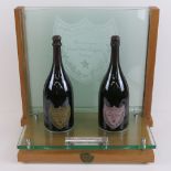 A Moet et Chandon champagne cuvee Dom Perignon double bottle lit display stand having pair of
