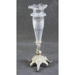 A single decorative glass flower holder raised over triform silver plated base, 21cm in height.