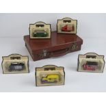 A pigskin leather small case containing five 'days gone' model vehicles within.