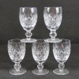 A set of four Waterford crystal glasses (with a spare), each standing 11.2cm high.