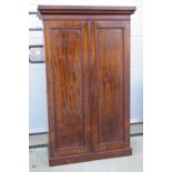 A late 19th century mahogany two door wardrobe,
