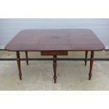 A good 19th century mahogany drop leaf dining table,