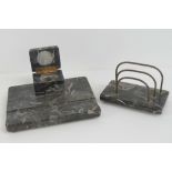A polished marble desk set comprising a two sectional letter rack with brass vase 18cm wide and a