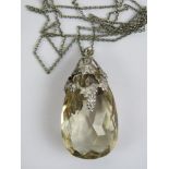 A large silver and quartz pendant,
