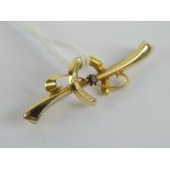 A 9ct gold bar brooch having horseshoe and purple stone upon, hallmarked 375, 4cm in length, 1.2g.
