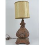 A carved hardwood lamp base having acanthus leaf pattern upon, for rewiring, 36cm high,